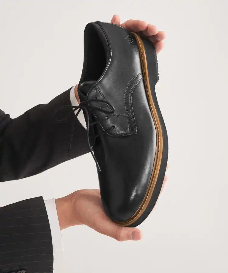 Woman standing wearing blue oxfords