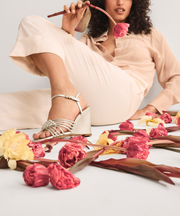 Woman standing wearing blue oxfords