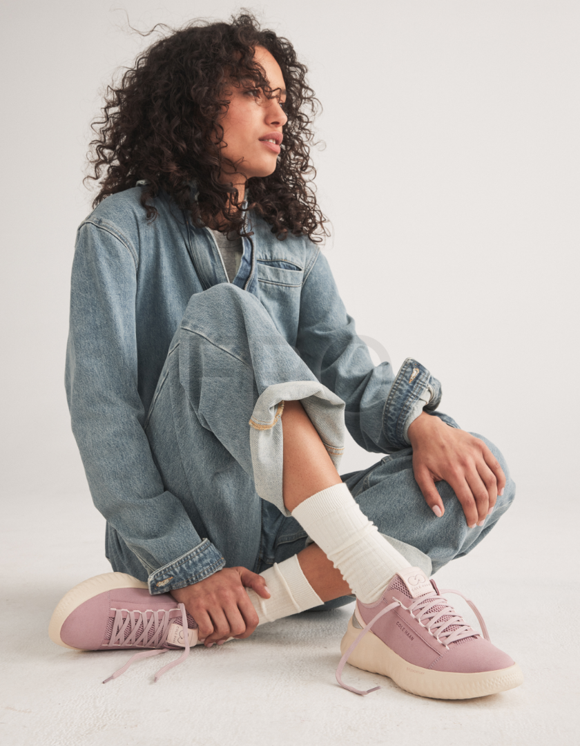 Woman standing wearing blue oxfords