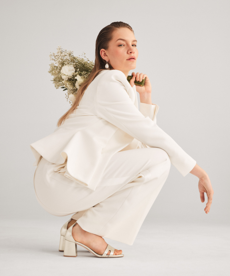 Woman standing wearing blue oxfords